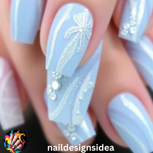 Icy baby blue Christmas nails are perfect for those who want a dramatic yet elegant holiday look.