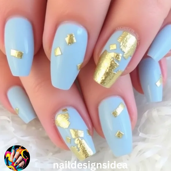 Gold foil accents provide a striking contrast to the cool tones of baby blue. Apply small pieces of gold foil randomly across the nails or along the edges for a chic and artistic look.