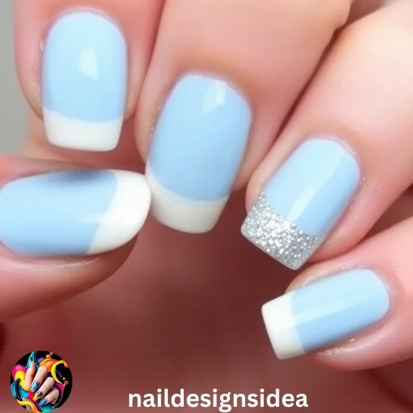 Frosted tips add a subtle yet stunning effect to your baby blue Christmas nails. 