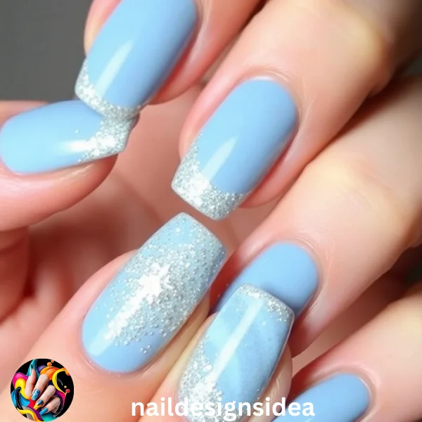 Add a touch of holiday glamour by incorporating glitter into your baby blue Christmas nails. 