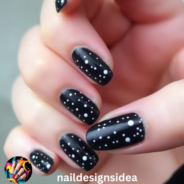 Start with a deep blue or black base, and use a nail art pen to add white dots and tiny stars