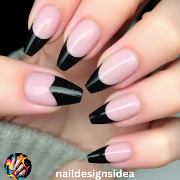 A classic French tip with a twist, black-tipped nails bring sophistication to dark Christmas nail designs