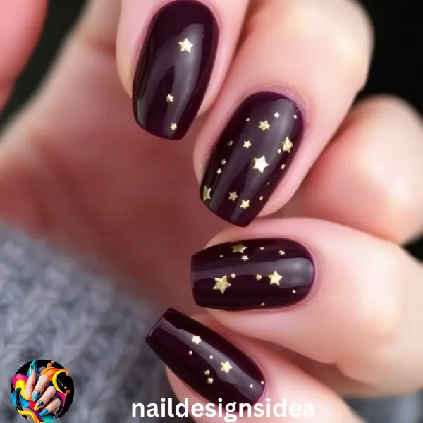 Plum with Tiny Gold Stars – A Festive Twist on Dark Christmas Nail Designs